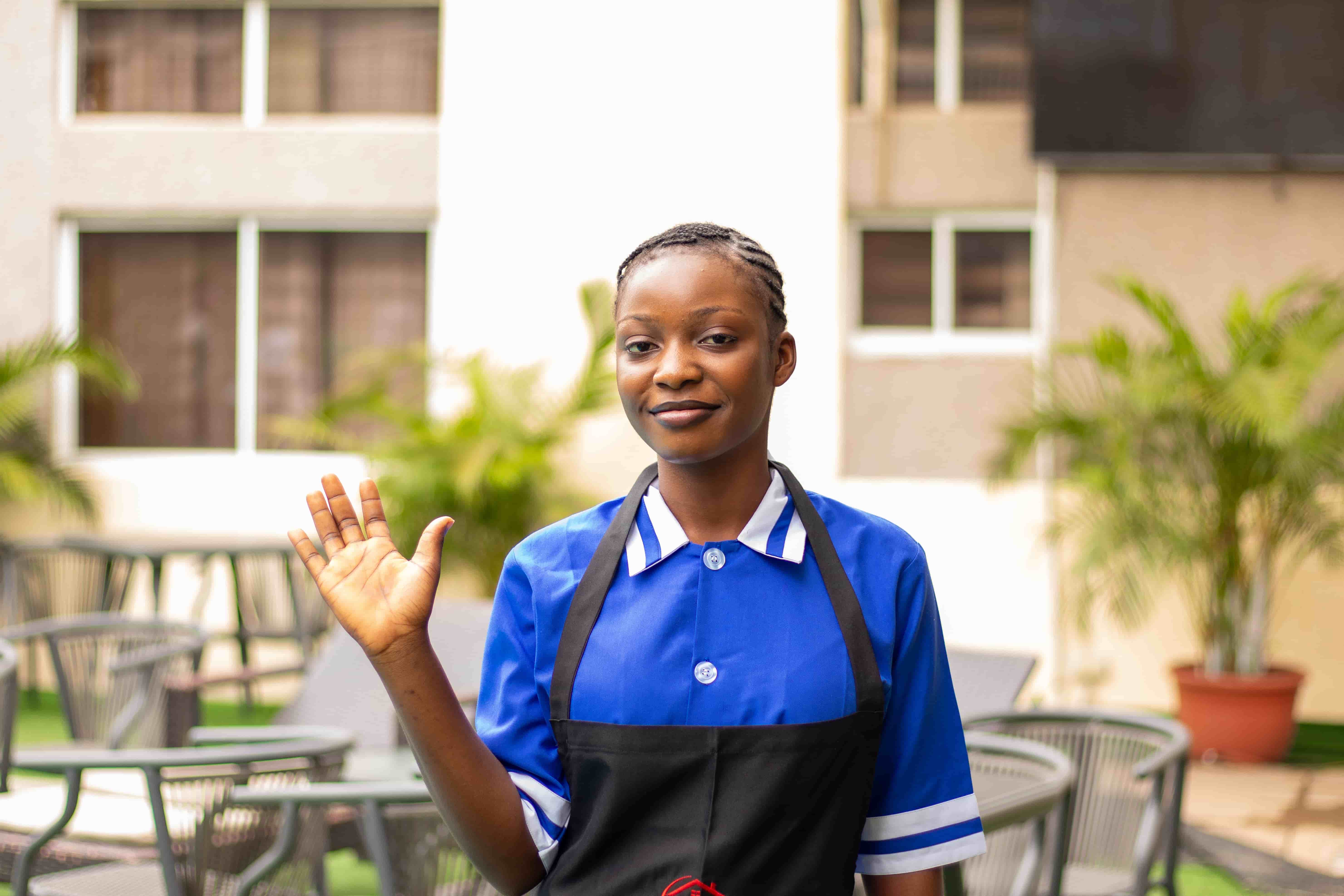 Domestic worker waving